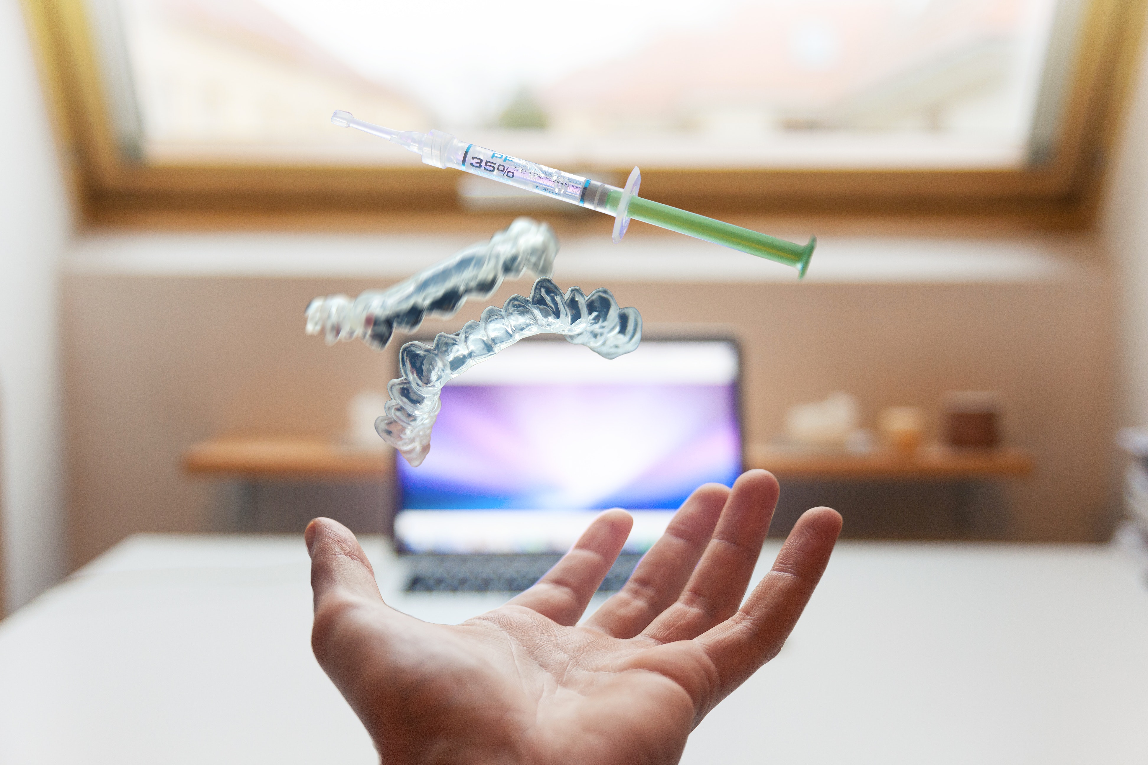 Image of nurse holding up syringe.